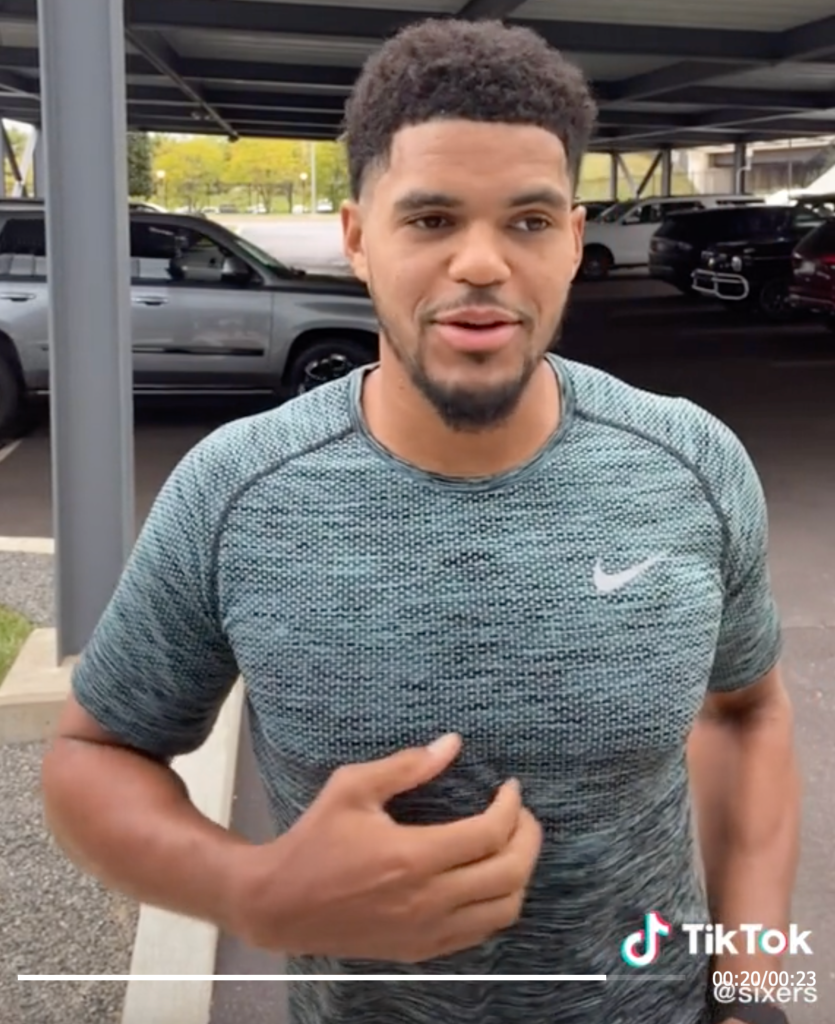 Tobias Harris puts mustard on his cheesesteak